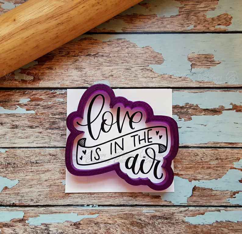 Love Is In The Air Hand Lettered Cookie Cutter and Fondant Cutter and Clay Cutter with Optional Stencil,
                      cookie stencil, stencil, baby stencil, letter stencils, stencil designs, custom stencils, 8 inch round cookie cutter, cookie shapes by hand, dog cookie cutters near me, mini gingerbread cookie cutter, mini gingerbread house cutters, custard cream biscuit cutter, micro cookie cutters, party hat cookie cutter,
                      