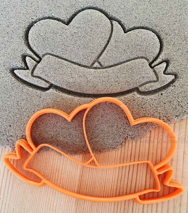 Hearts with bow Cookie Cutter,
                      heart cookie cutter, heart shaped cookie cutter, heart cutter, heart shape cutter, mini heart cookie cutter, love heart cookie cutter, eiffel tower cookie cutter, bunny cookie cutter michaels, disney cookie cutters michaels, 1 inch star cookie cutter, mini pie crust cutters, snowflake cutters, myer cookie cutter, lilo and stitch cookie cutters,
                      